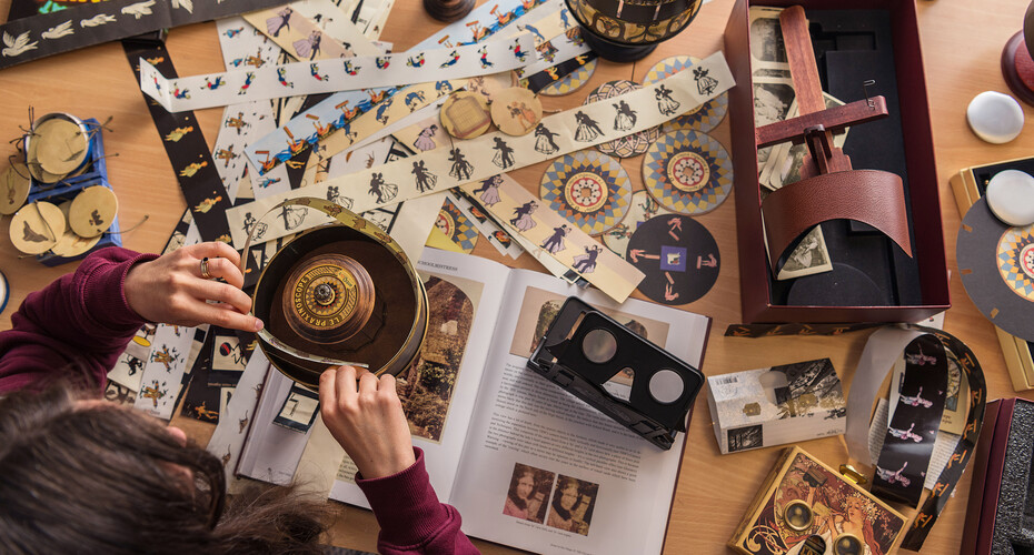 A student looking at items in the Bill Douglas Cinema Museum